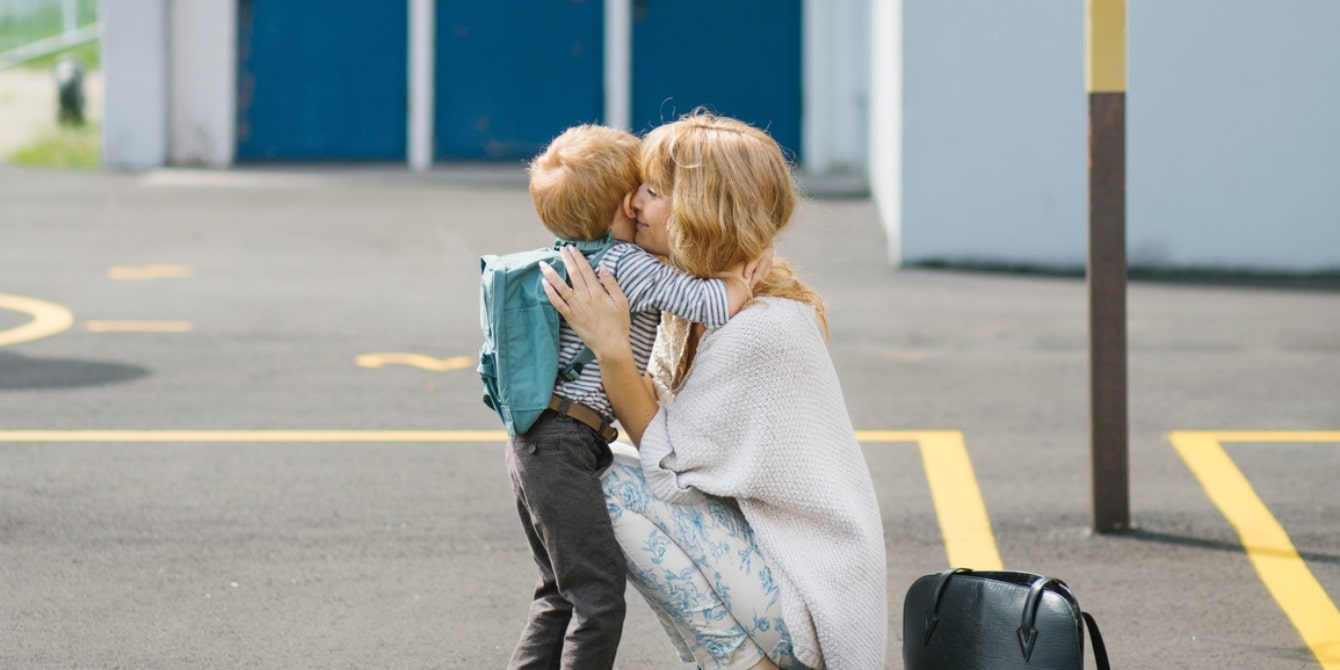 mother-hugging-preschool-son-at-school-dropoff